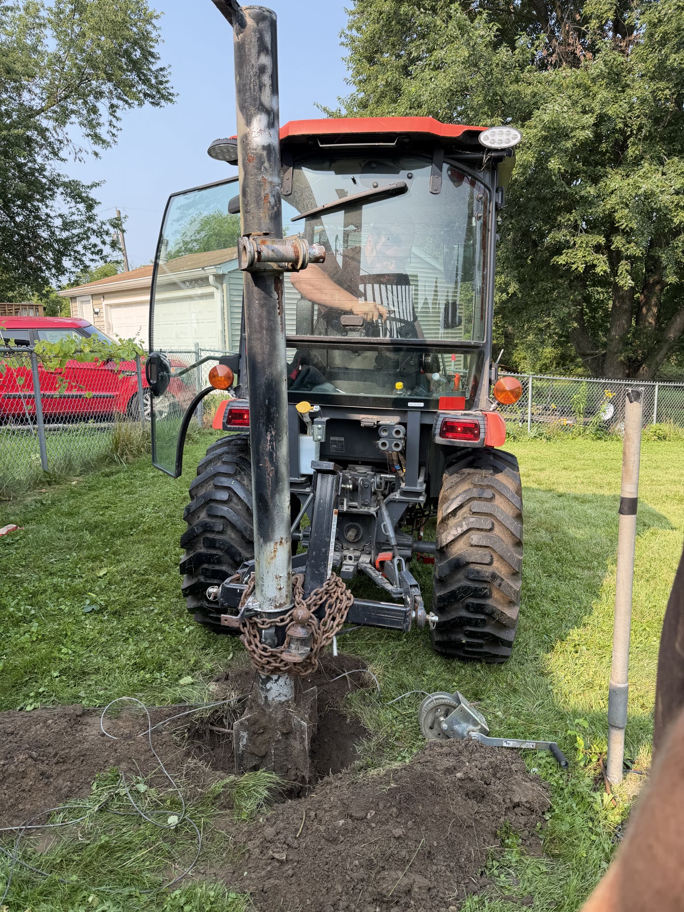 The mast coming out of the ground after the tractor worked it loose.