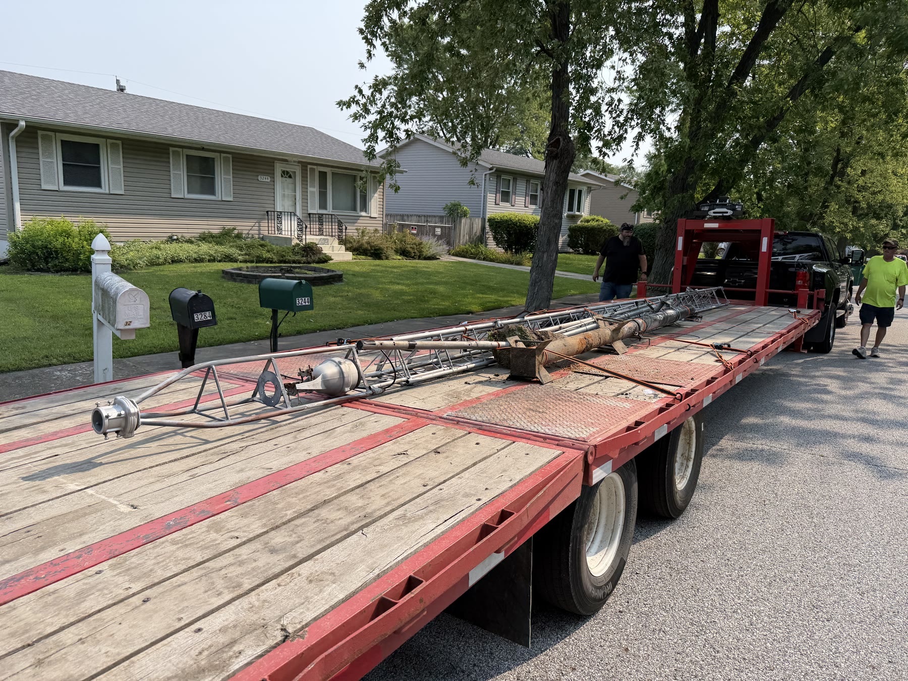 The tower, mast, poles, and antenna components loaded and strapped for the trip home.